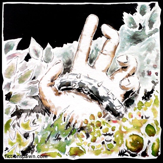 The hand of a man trapped in the ground.